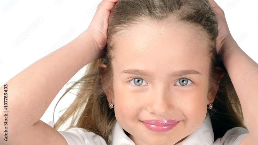 Teenage girl blonde smiling and posing on white background,slow motion Teenage girl blonde smiling and posing on white background,slow motion