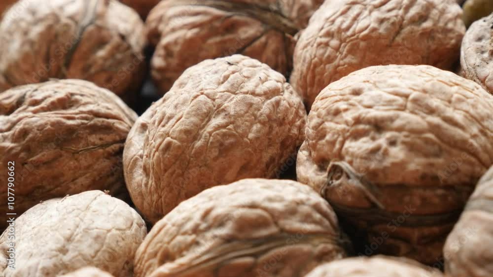 Arranged on the table walnuts slow panning 4K 2160p 30fps UltraHD video - Raw food background of walnut in the shell 4K 3840X2160 UHD pan footage Arranged on the table walnuts slow panning 4K 2160p 30fps UltraHD video - Raw food background of walnut in the shell 4K 3840X2160 UHD pan footage