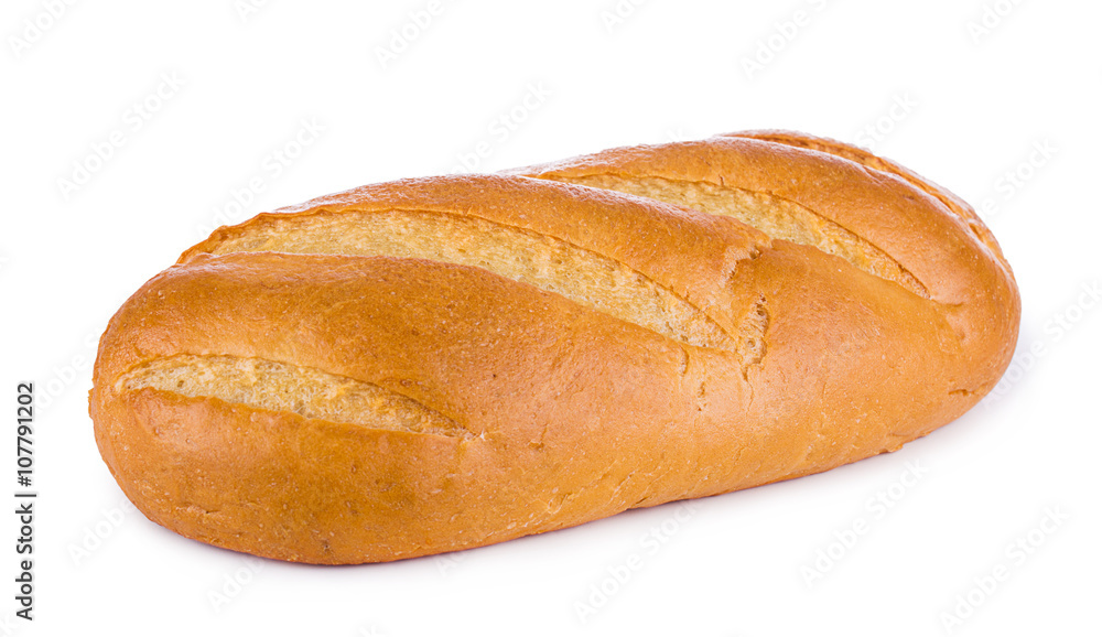White wheaten long loaf on a white background. Bread close-up. White wheaten long loaf on a white background. Bread close-up.