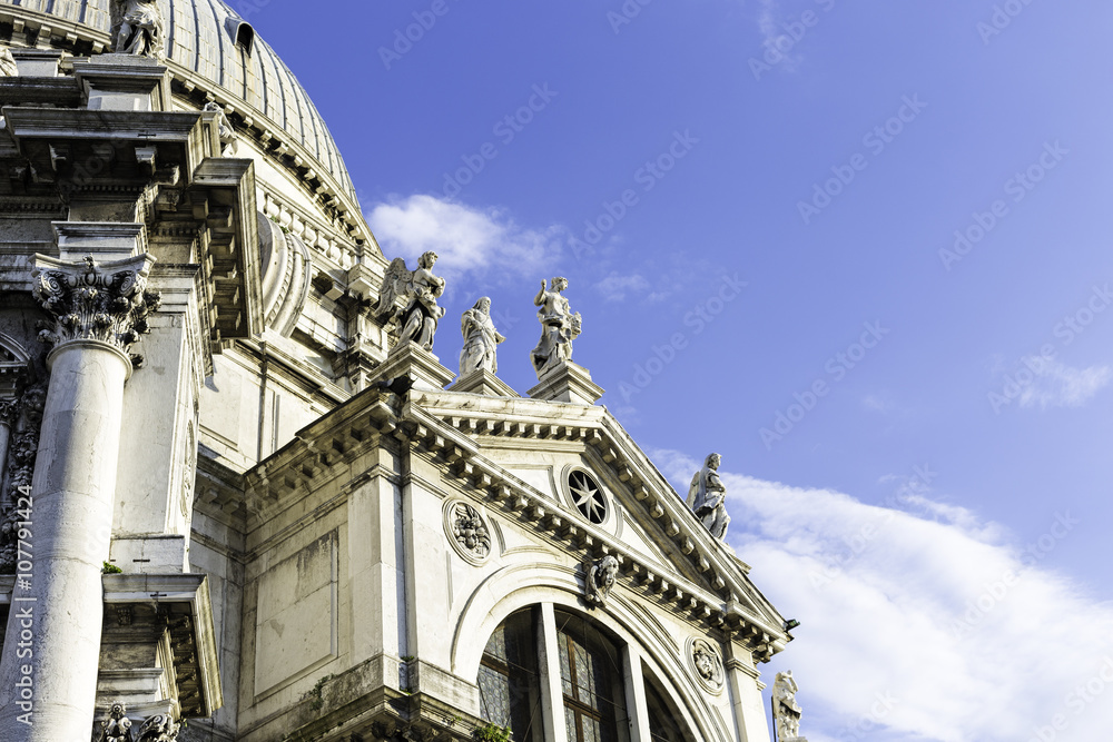 Closeup view of Santa Maria della Salute which is a Roman Catholic church and minor basilica located at Punta della Dogana in the Dorsoduro sestiere of the city of Venice, Italy.