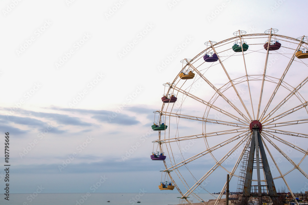 Ferris wheel on sky background