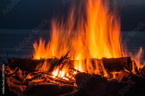 Campfire at twilight on beach