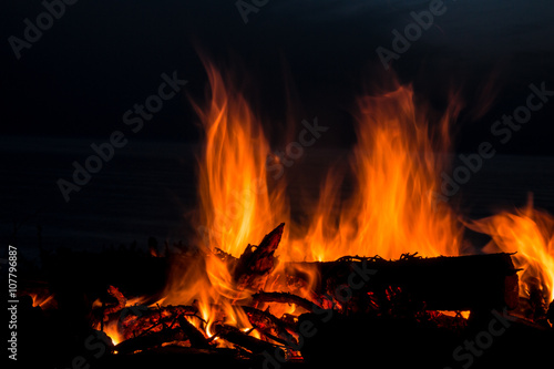 Campfire at twilight on beach