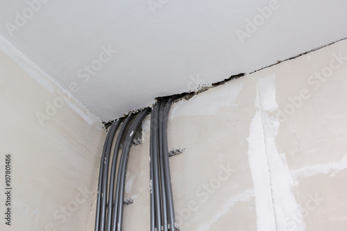 nine polyethylene pipe goes between wall and the ceiling