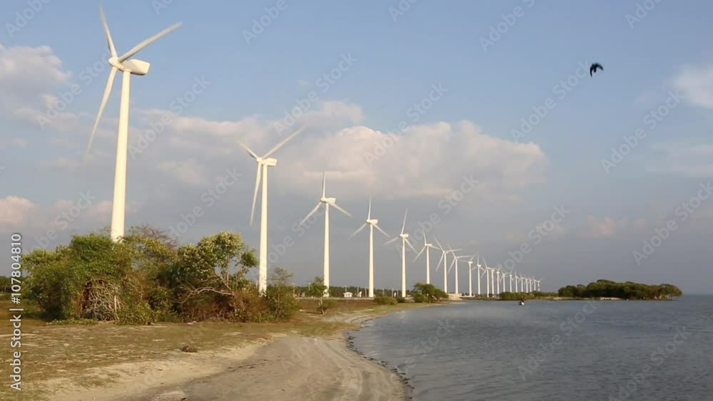 Scenic view of rotating turbines of wind farm on the shores of Puttalam Lagoon in Sri Lanka Scenic view of rotating turbines of wind farm on the shores of Puttalam Lagoon in Sri Lanka