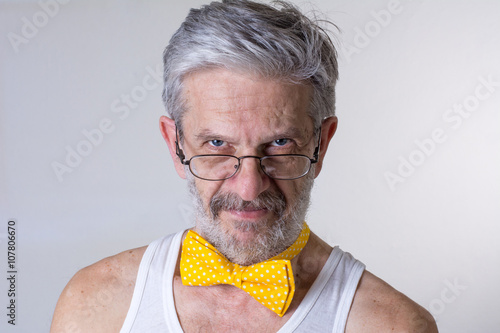 Funny man with bow tie arround his neck photo