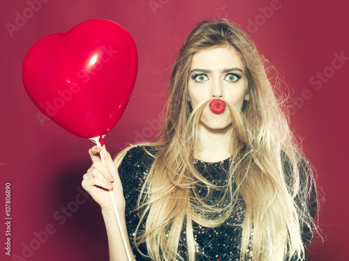 Woman with heart balloon