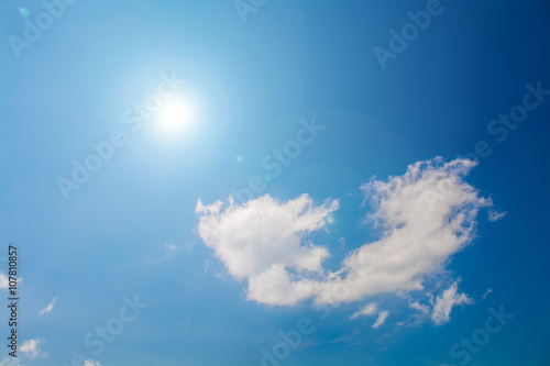 The Sun   clouds on blue sky with lens flare
