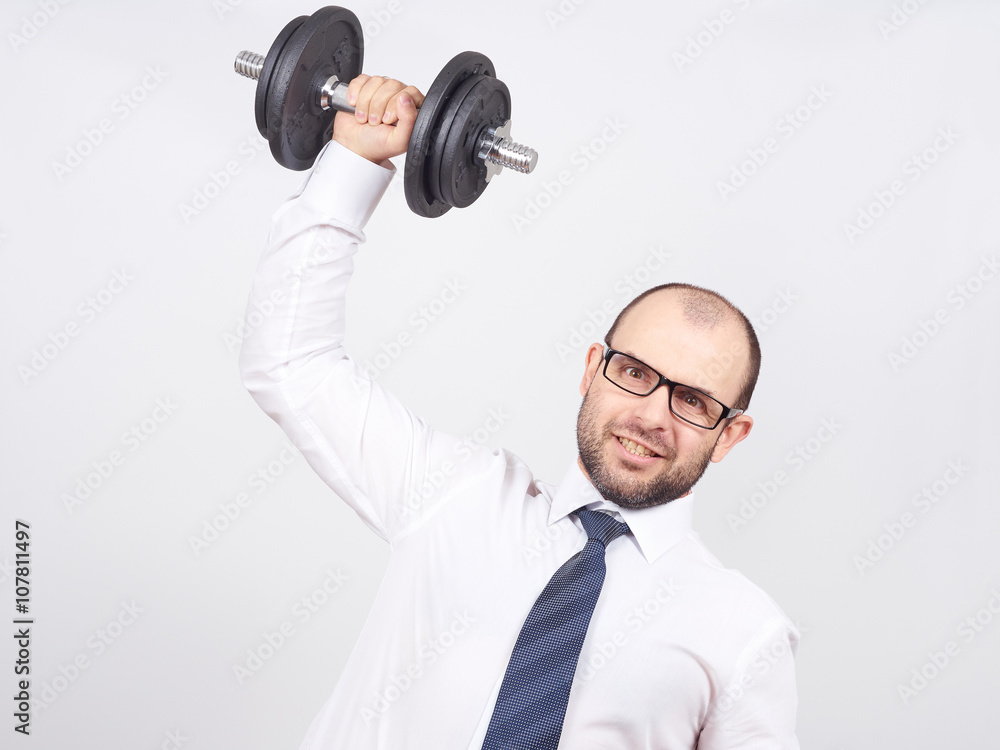 Naklejka premium Man Trained businessman raises dumbbell.