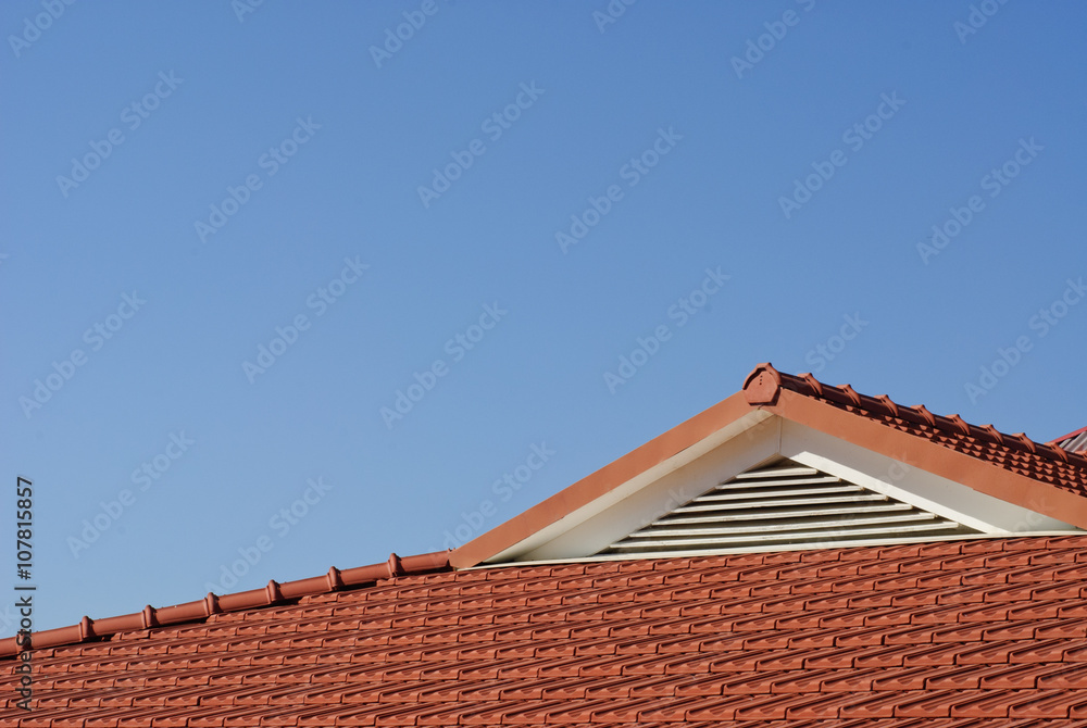 new red rooftop against blue sky new red rooftop against blue sky