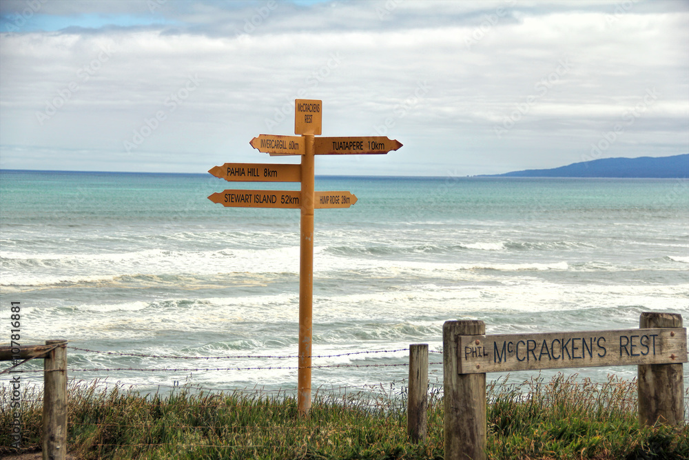 The signpost at McCraken Rest near to Tuatapere-Orepuki Hwy, Te Waewae, New Zealand