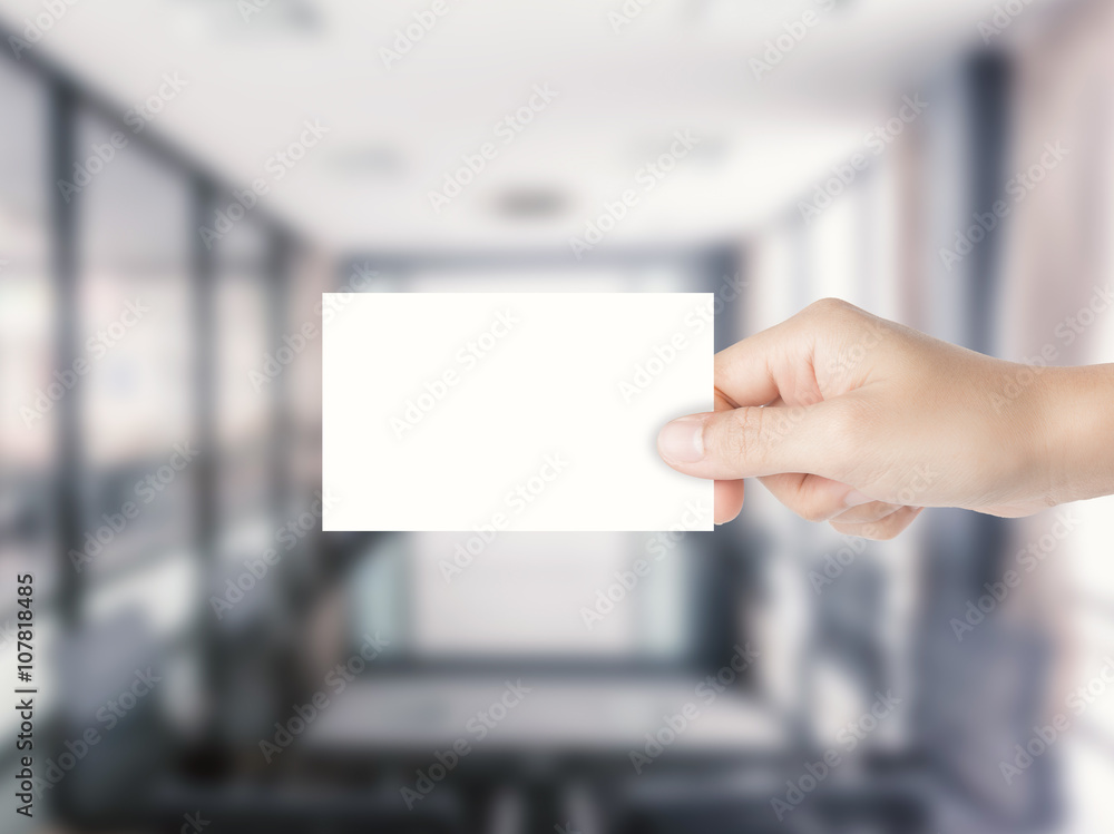 hand holding blank namecard with office background hand holding blank namecard with office background