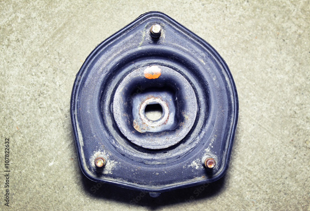 Support rear suspension of the car on a gray background Support rear suspension of the car on a gray background