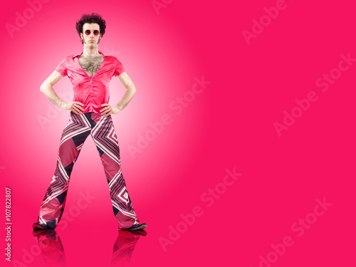 1970s vintage man stand with pink background