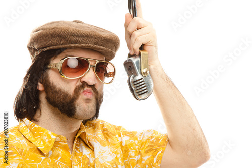 Fotografija 1970s vintage show man sing with hawaiian shirt and microphone isolated on white