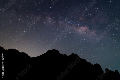 Milky way and silhouette of mountain