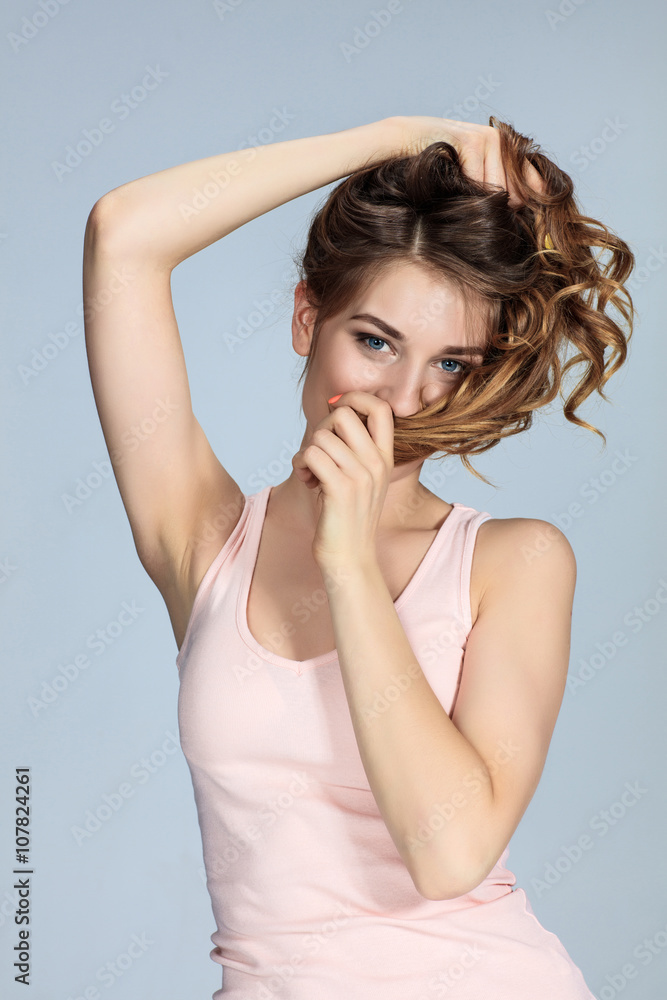 The young woman's portrait with happy emotions The young woman's portrait with happy emotions