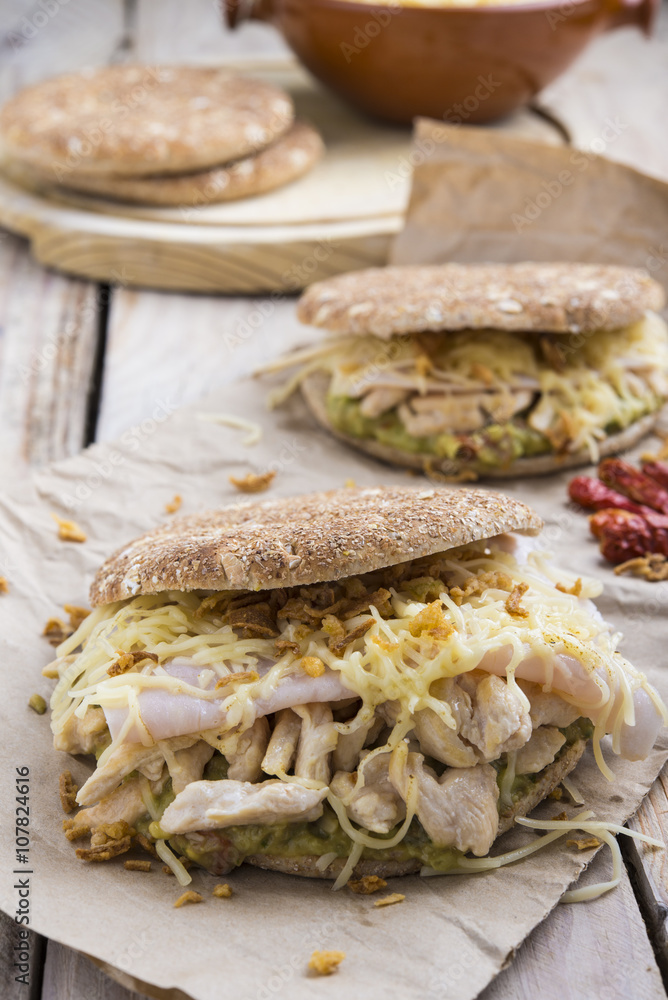 Sandwich with chickend and guacamole, cheese. Sandwich with chickend and guacamole, cheese.