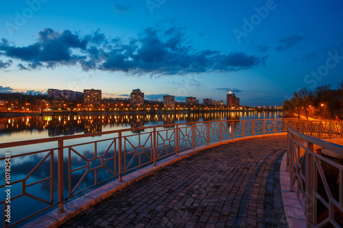 Night city reflection on the river in Donetsk. Ukraine photo