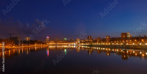 Night city reflection on the river in Donetsk. Ukraine