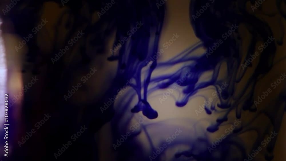 Figure of Blue Paint Frozen in Clear Water in a Glass Bottle Figure of Blue Paint Frozen in Clear Water in a Glass Bottle