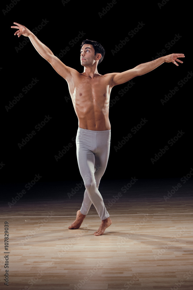 handsome classical dancer on black background