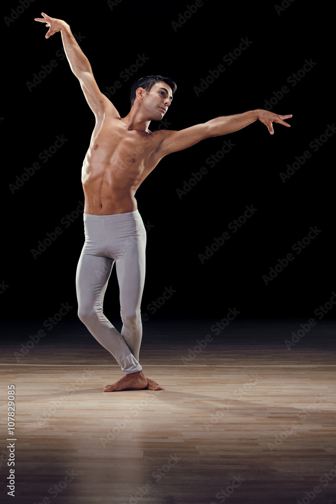 handsome classical dancer on black background