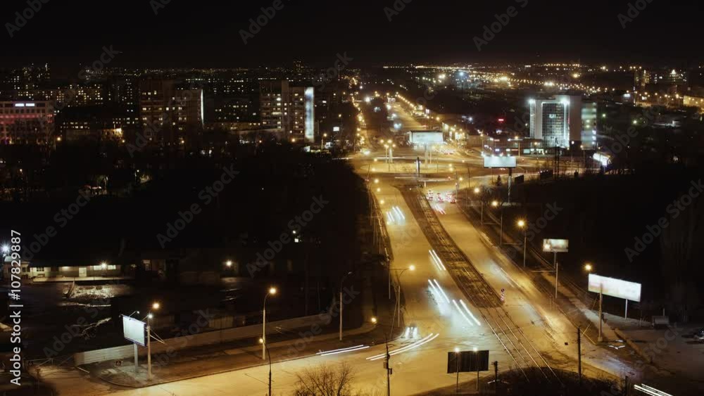 City Traffic At Night, Time Lapse. The cars are moving upon the road very fast City Traffic At Night, Time Lapse. The cars are moving upon the road very fast