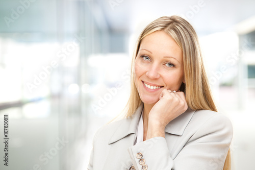 european caucasian blonde happy business woman portrait at office