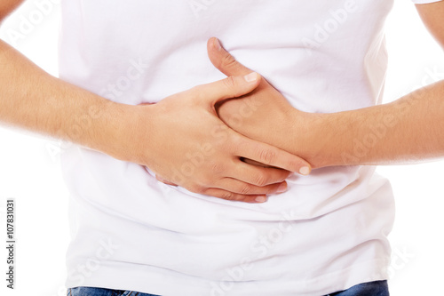 Young man with strong stomachache