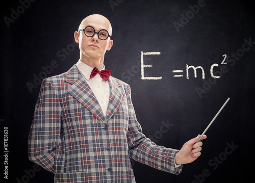 Canvas Print bald caucasian professor or teacher with bow tie and glasses point stick on blac