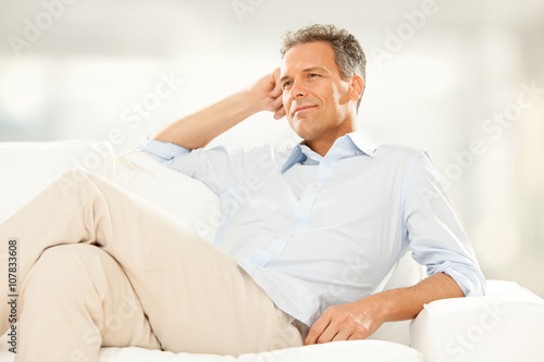 handsome businessman Relax on the couch at home