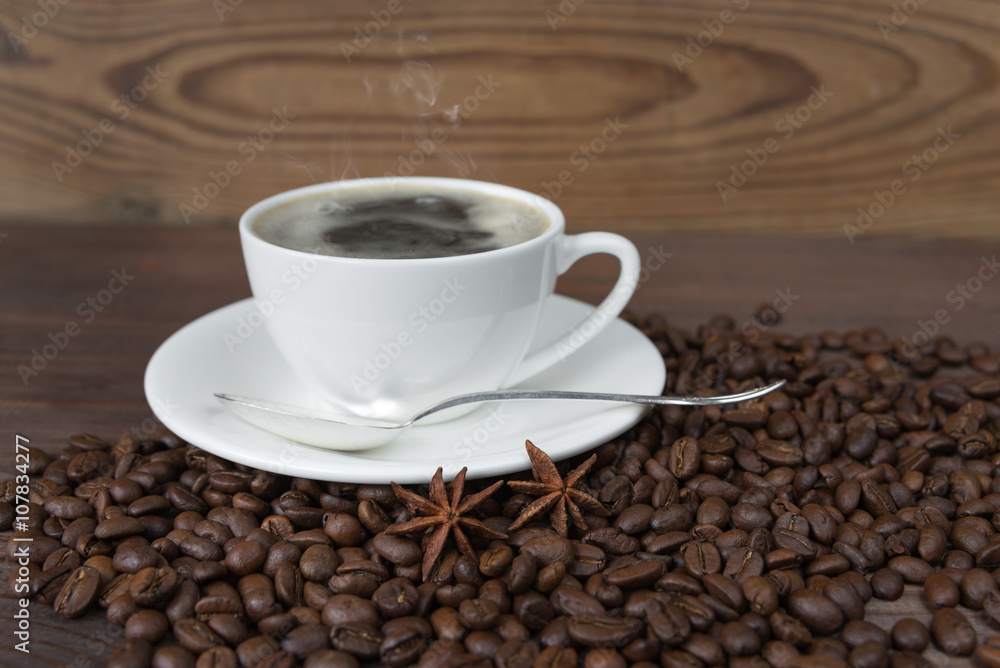 A cup of coffee and coffee beans A cup of coffee and coffee beans