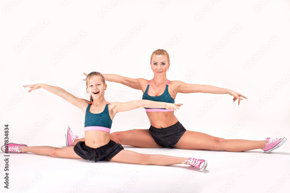 Mother and daughter exercise.