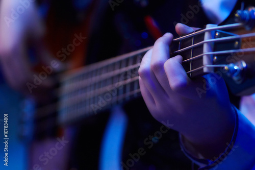 girl plaing bass guitar