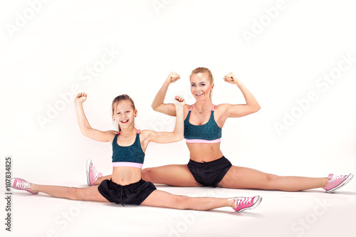 Mother and daughter exercise.