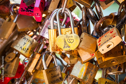 Love padlocks on parisian bridge photo