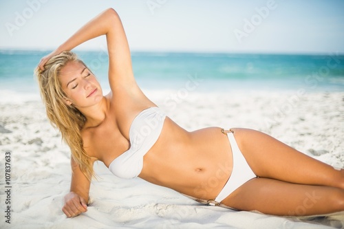 Relaxed woman posing at the beach
