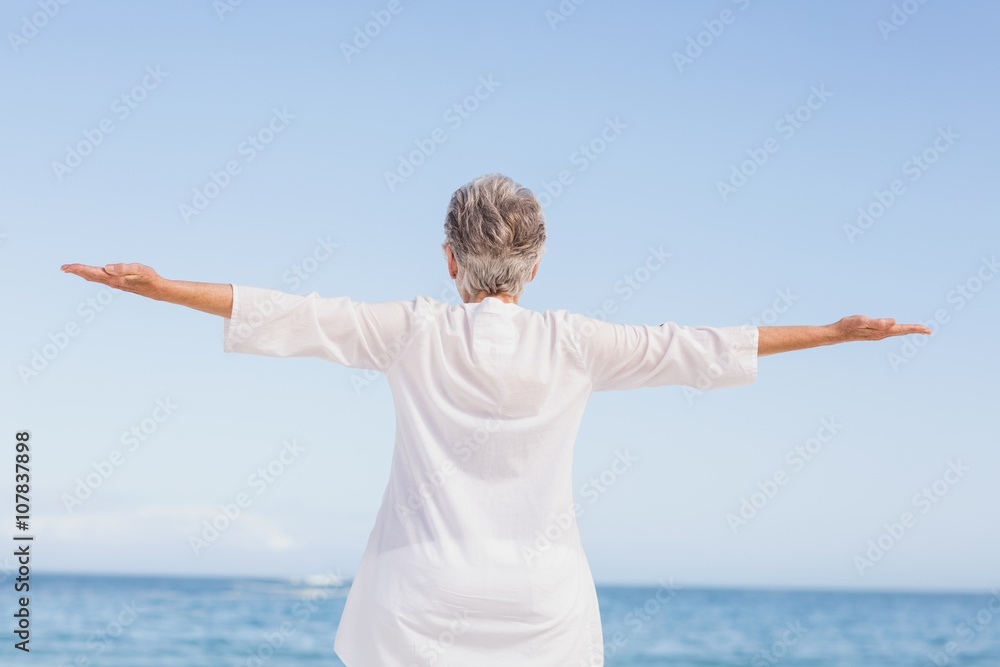 Casual senior woman with arms outstretched Casual senior woman with arms outstretched