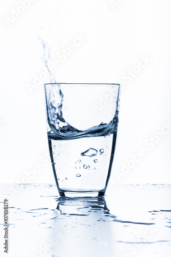 water splashing from glass isolated on white background