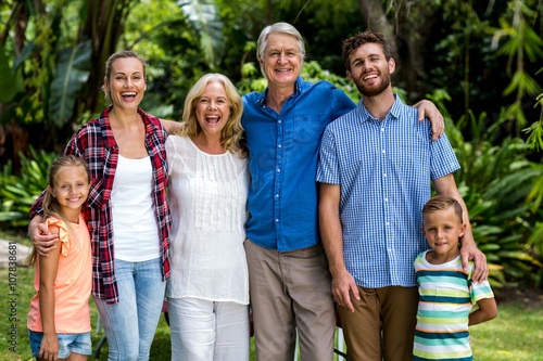 Happy multi generation family standing in yard  © WavebreakMediaMicro
