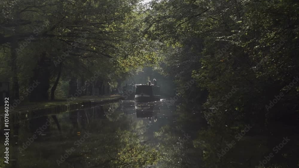 Autumn Morning On The Famous Llangollen Canal. Lovely sunbeams through the top of the autumn trees reflecting on the canal water. Autumn Morning On The Famous Llangollen Canal. Lovely sunbeams through the top of the autumn trees reflecting on the canal water.