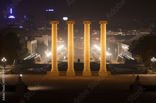 View from Palau Nacional towards the Four Columns and Placa d Espanya at night in Barcelona photo