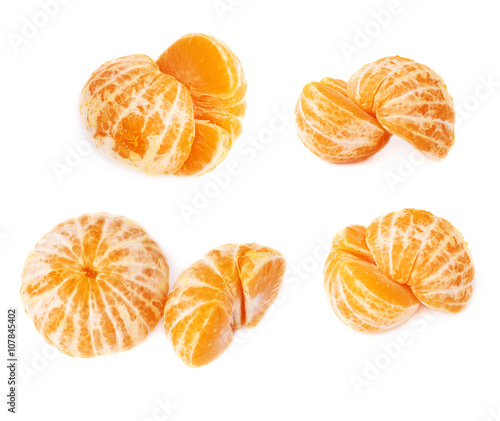 Two halves of fresh juicy tangerine fruit isolated over the white background