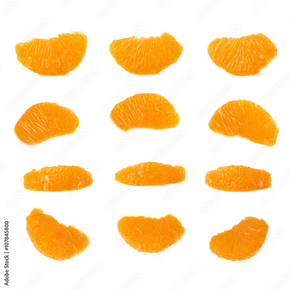Slice sections of tangerine isolated over the white background Slice sections of tangerine isolated over the white background