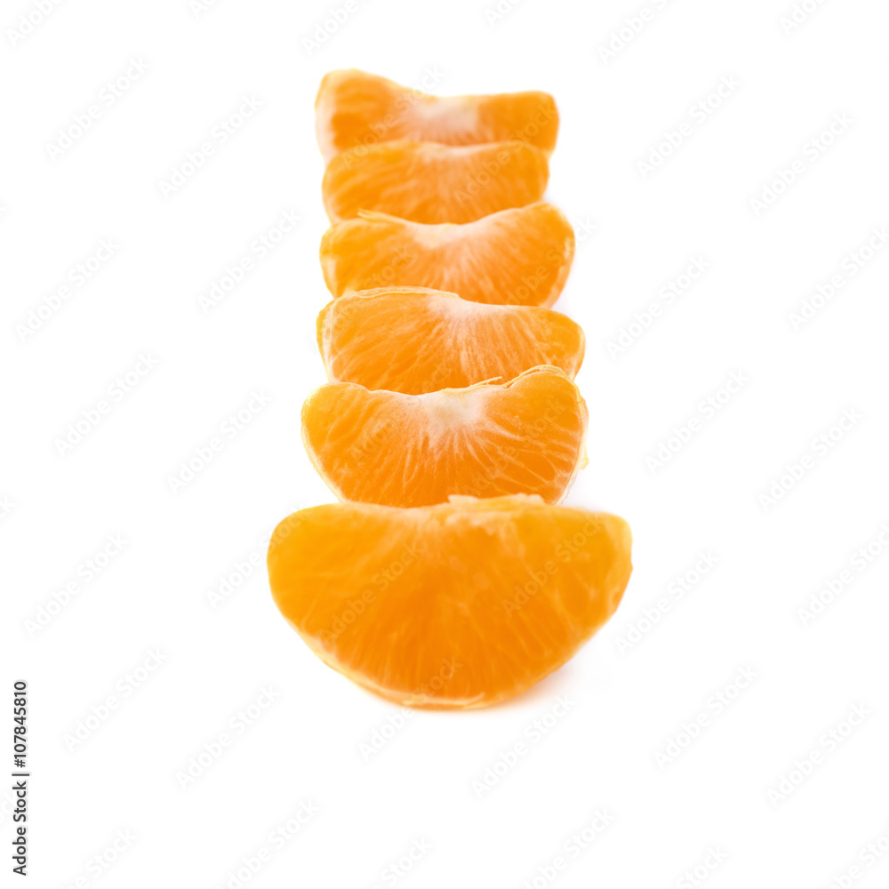 Slice sections of tangerine isolated over the white background Slice sections of tangerine isolated over the white background