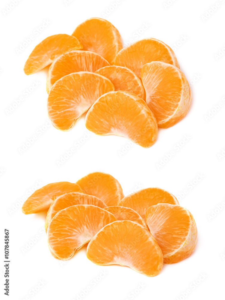Pile of slice sections of tangerine isolated over the white background Pile of slice sections of tangerine isolated over the white background