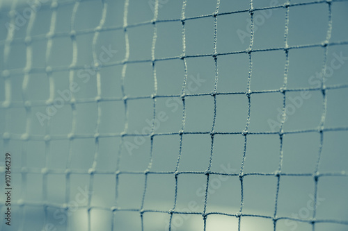 Close up of net in badminton court for sport background fade vintage filter