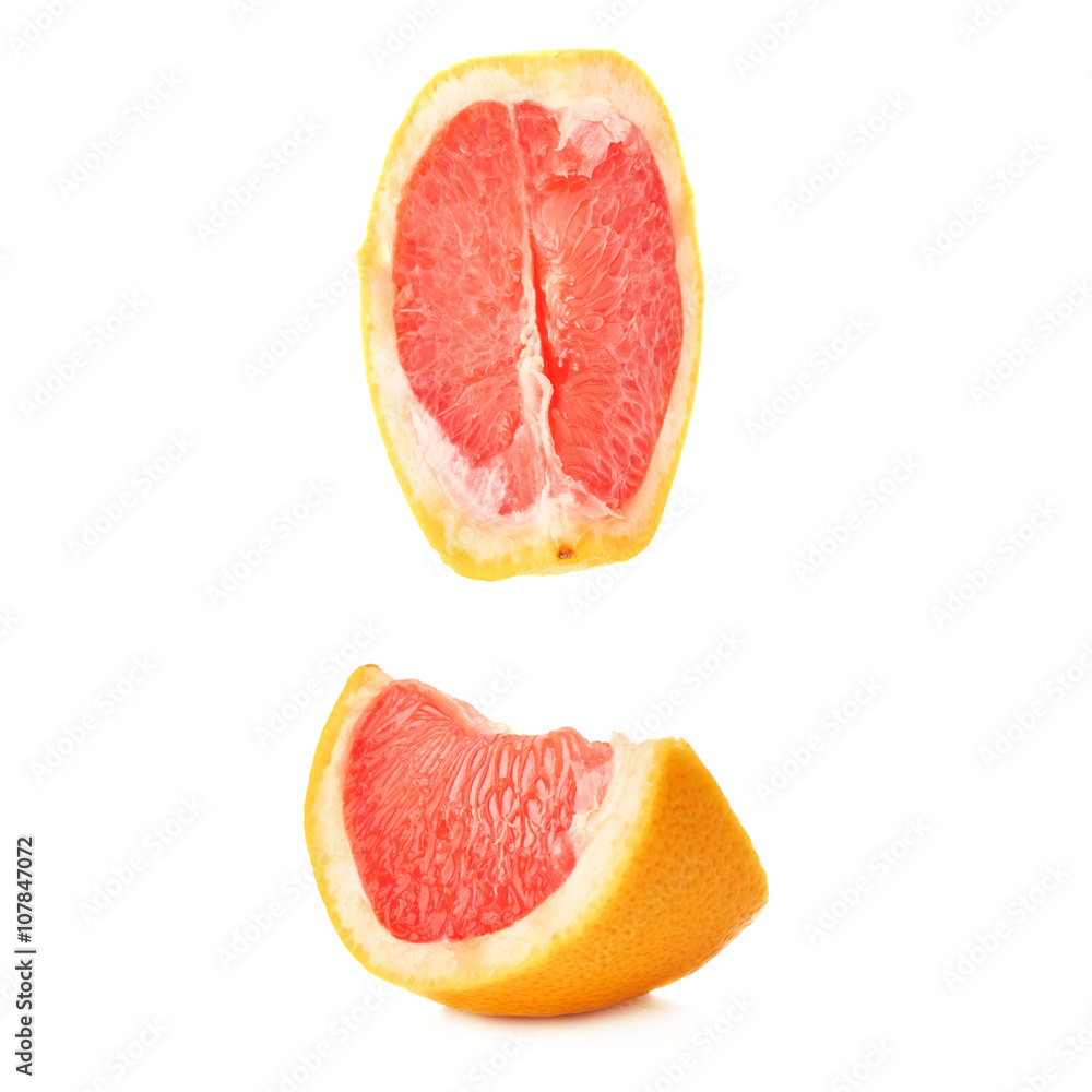 Slice section of grapefruit isolated over the white background Slice section of grapefruit isolated over the white background