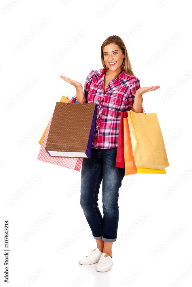 Young smiling woman holding shopping bags Young smiling woman holding shopping bags